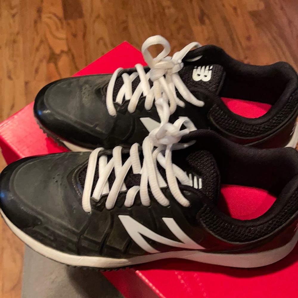 Black and white like new turf cleats